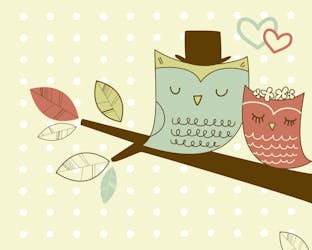 Two owls sitting on a branch